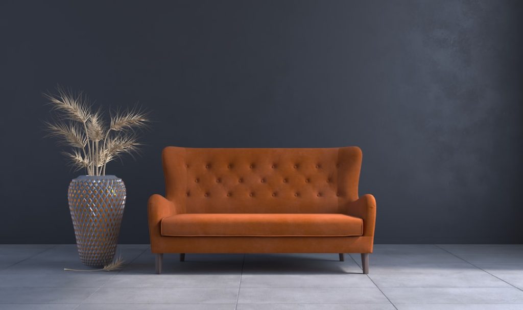 Les tendances modernes a-living-room-with-a-couch-and-a-vase-iy3gn4iplw8