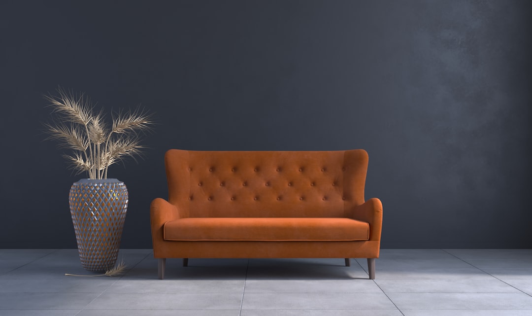 a-living-room-with-a-couch-and-a-vase-iy3gn4iplw8