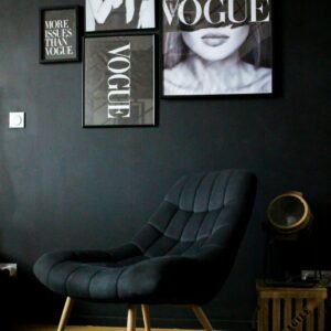 black-leather-armchair-beside-black-wall-gx3hm1ntktq